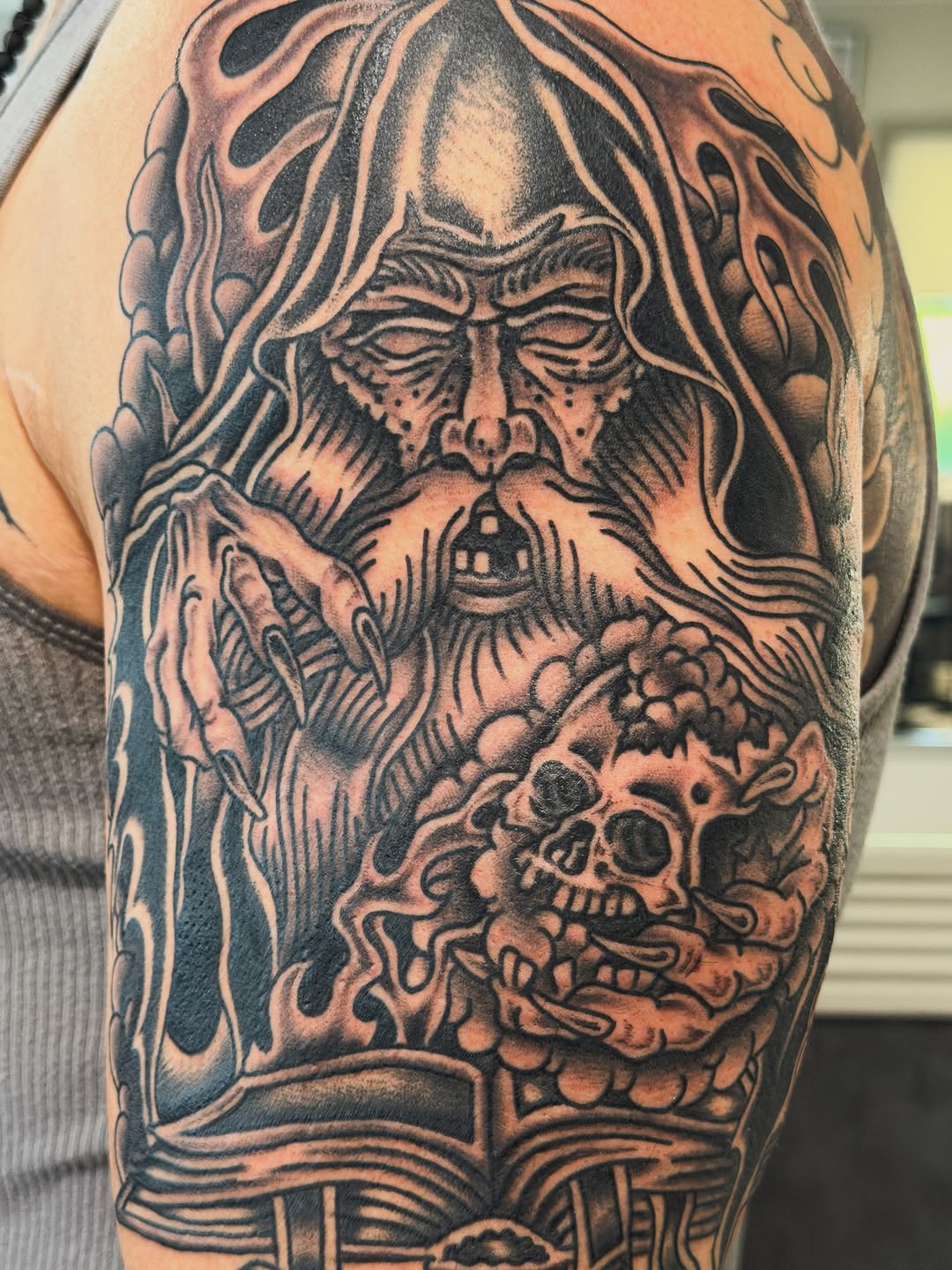 Tattoo by @tonykaplantattoo — black_and_grey, dark_realism
