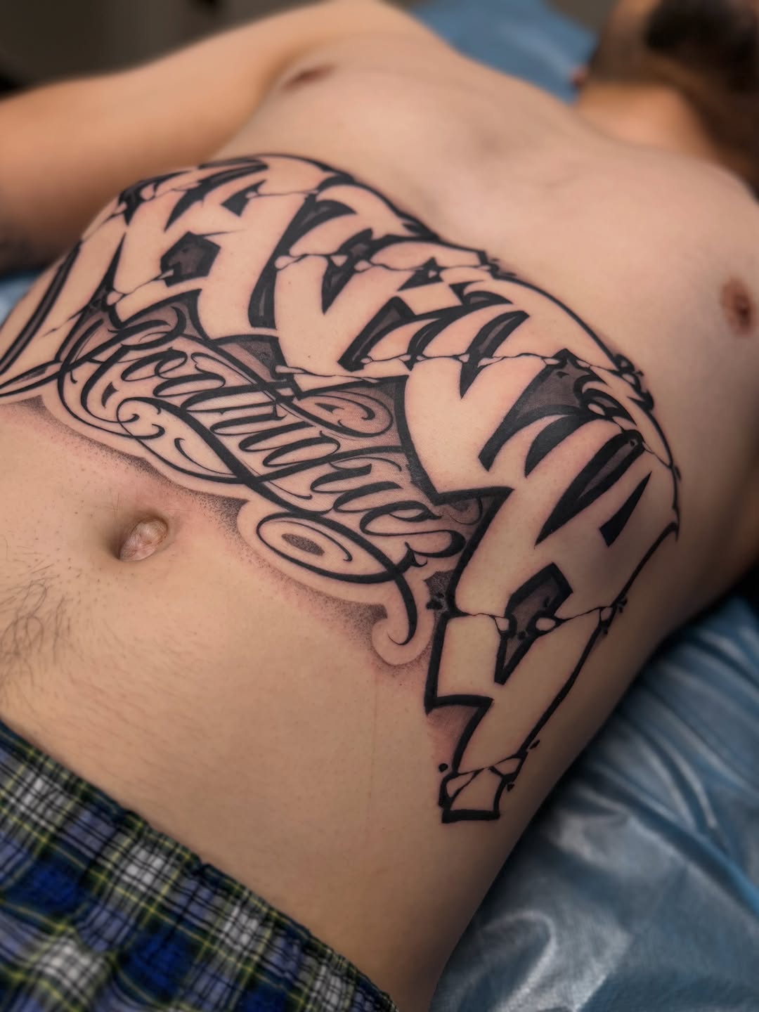 Tattoo by @aleckzi_ramos — lettering_script, blackwork
