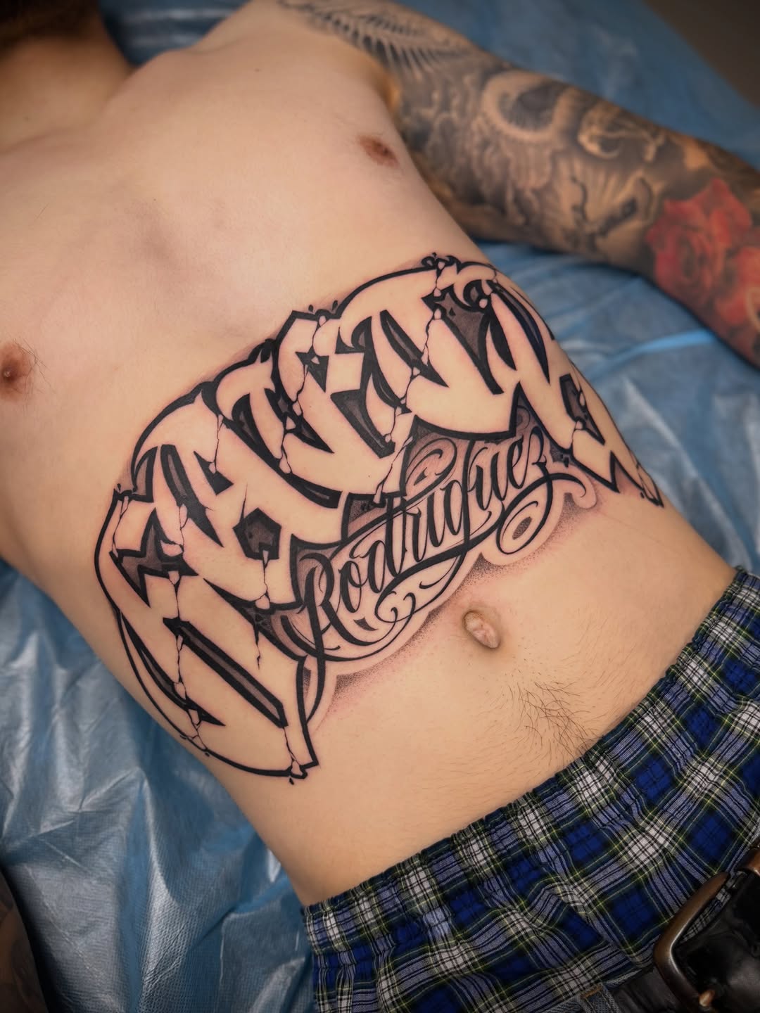Tattoo by @aleckzi_ramos — lettering_script, chicano