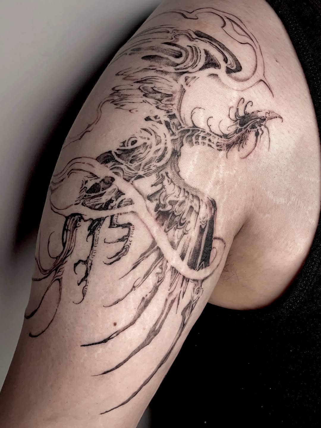 Tattoo by @rayzhu.tattoo — blackwork, illustrative