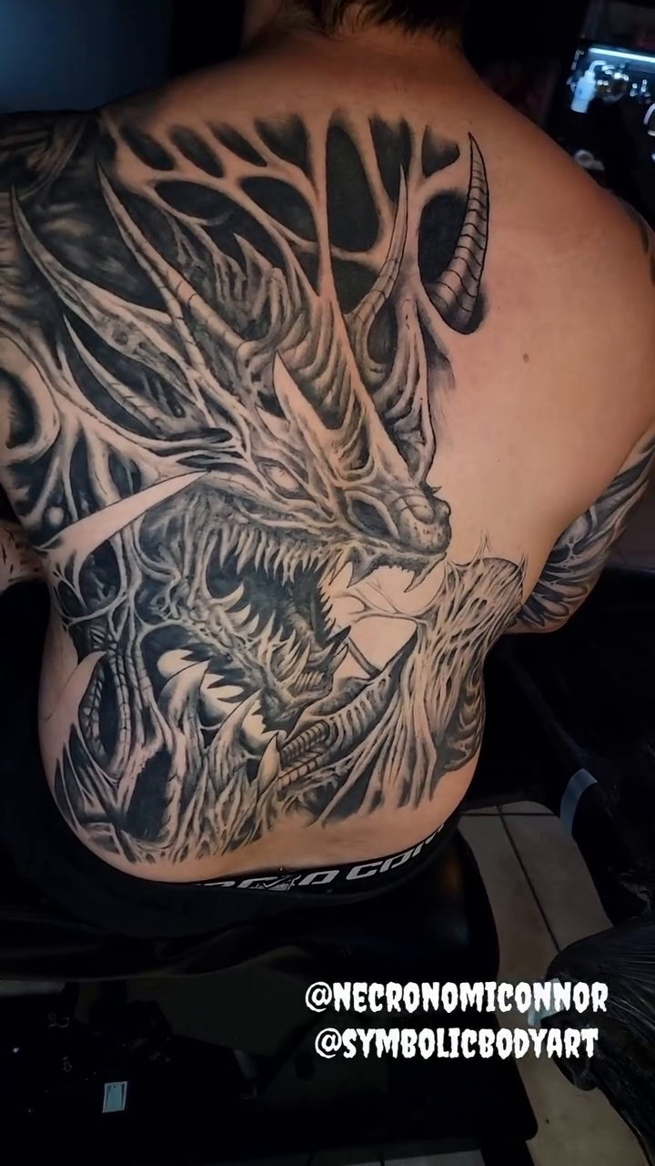 Tattoo by @necronomiconnor — dark_realism, black_and_grey