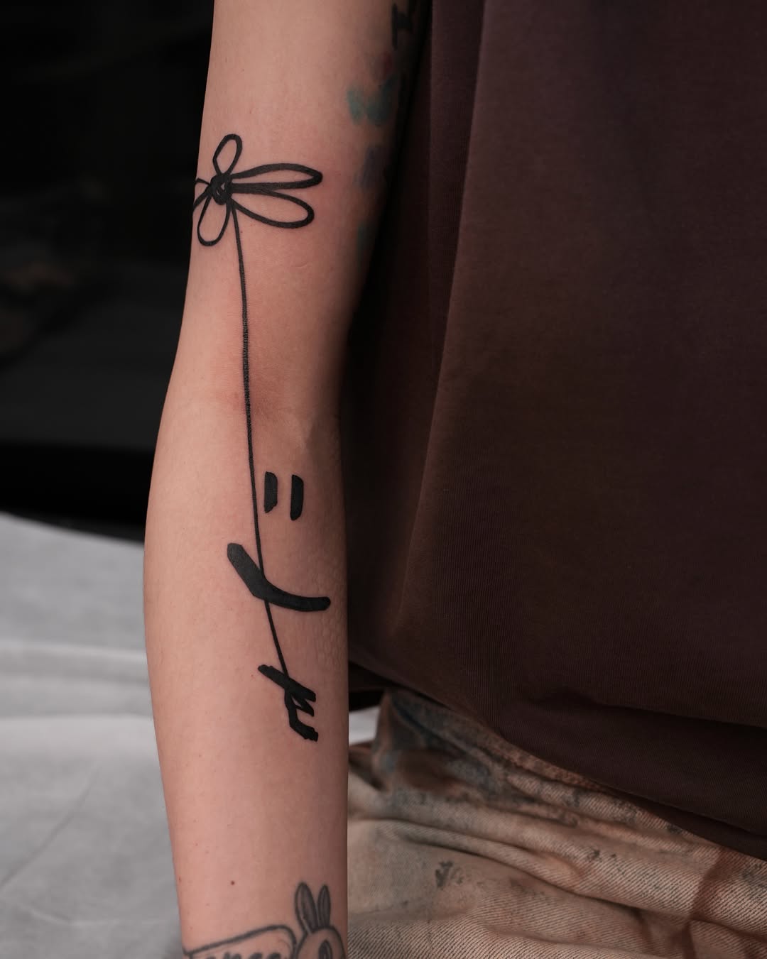 Tattoo by @m.tattooist.iv — lettering_script, minimalist