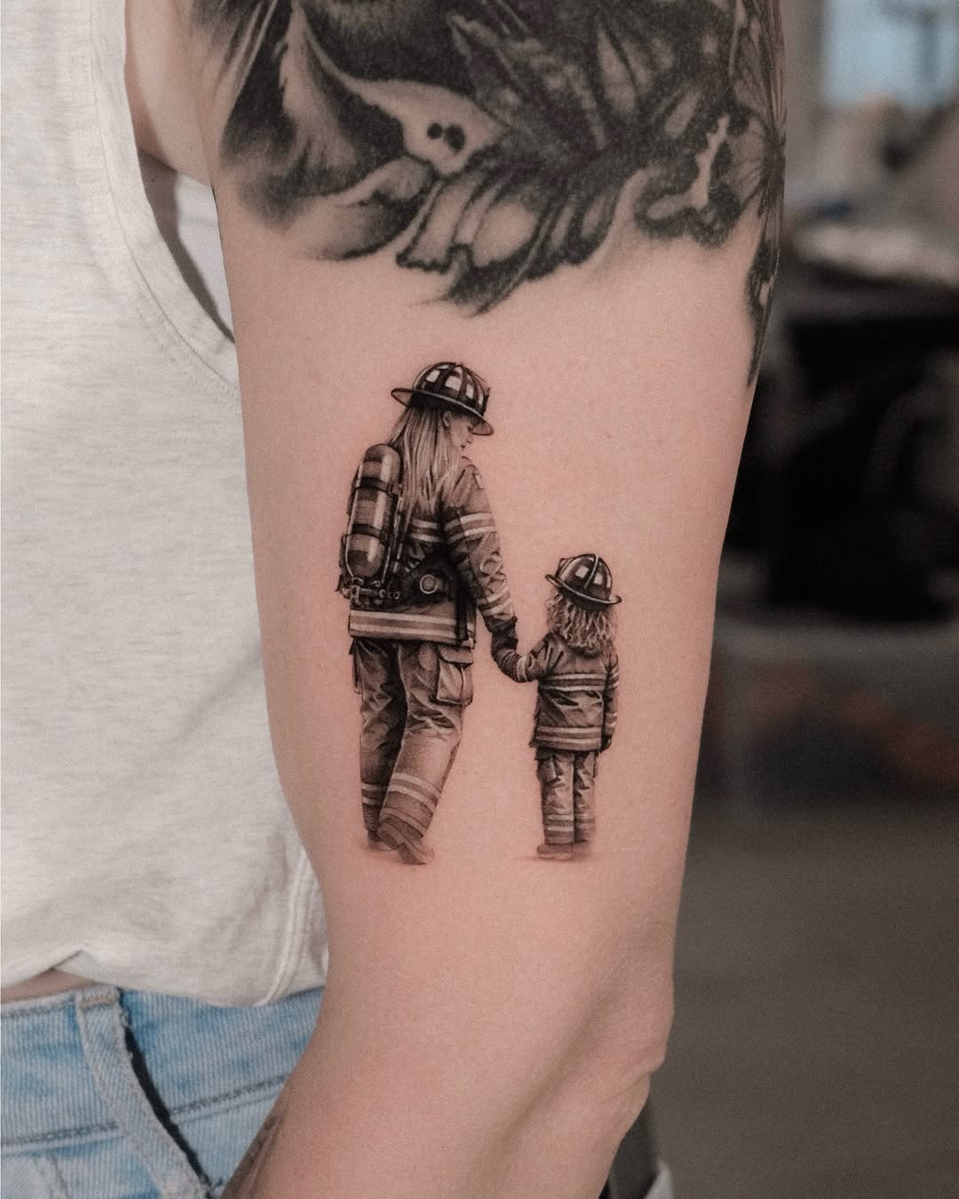 Tattoo by @dionne.tattoo โ realism, black_and_grey