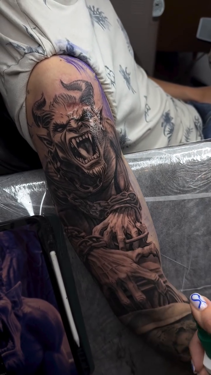Tattoo by @irena.tattooing — dark_realism, black_and_grey