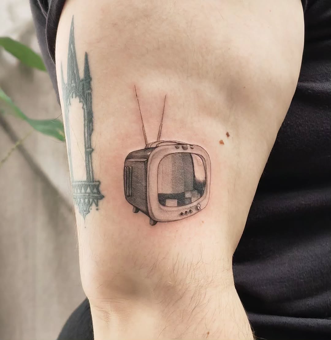 Tattoo by @m3ga.p1xlz — realism, black_and_grey