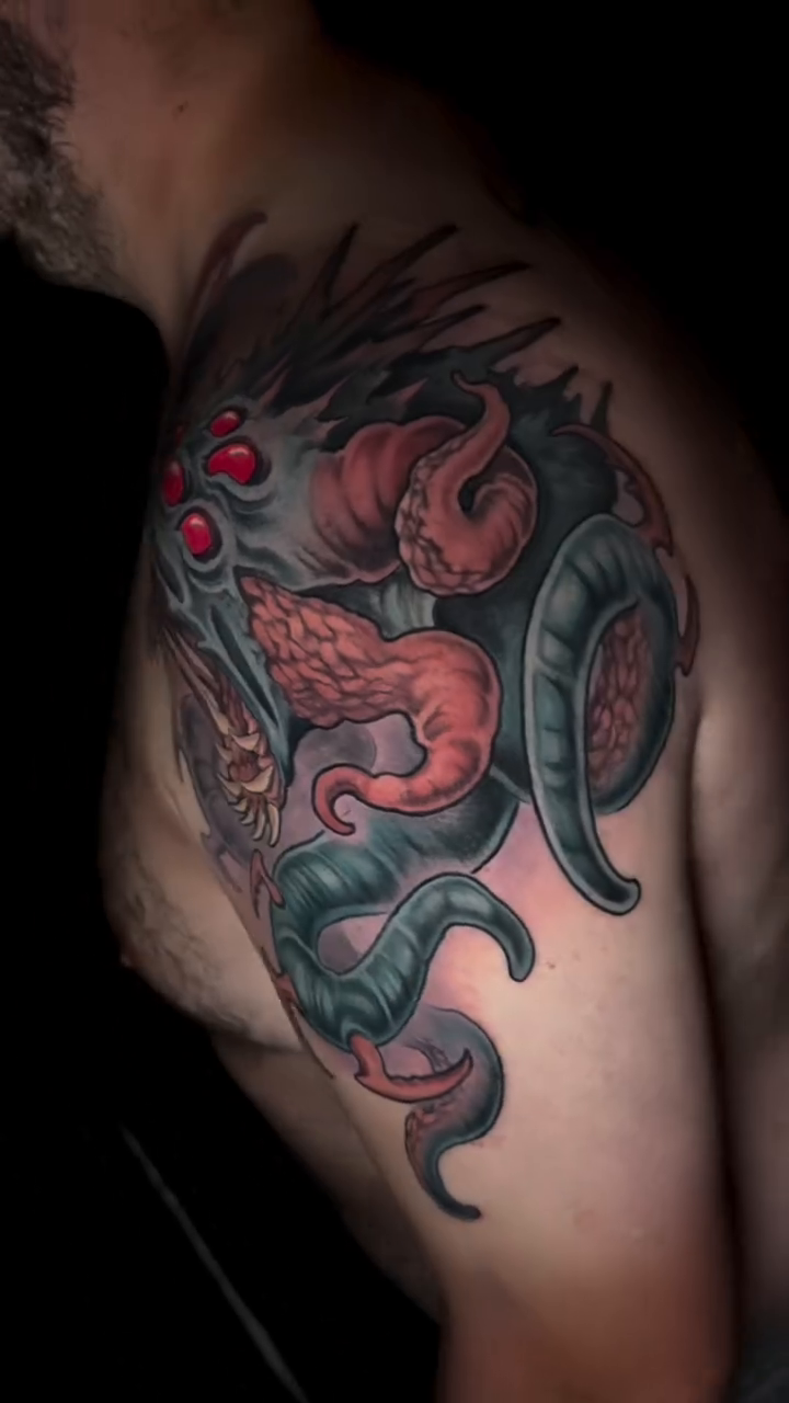 Tattoo by @krissy.carnage — dark_realism, black_and_grey