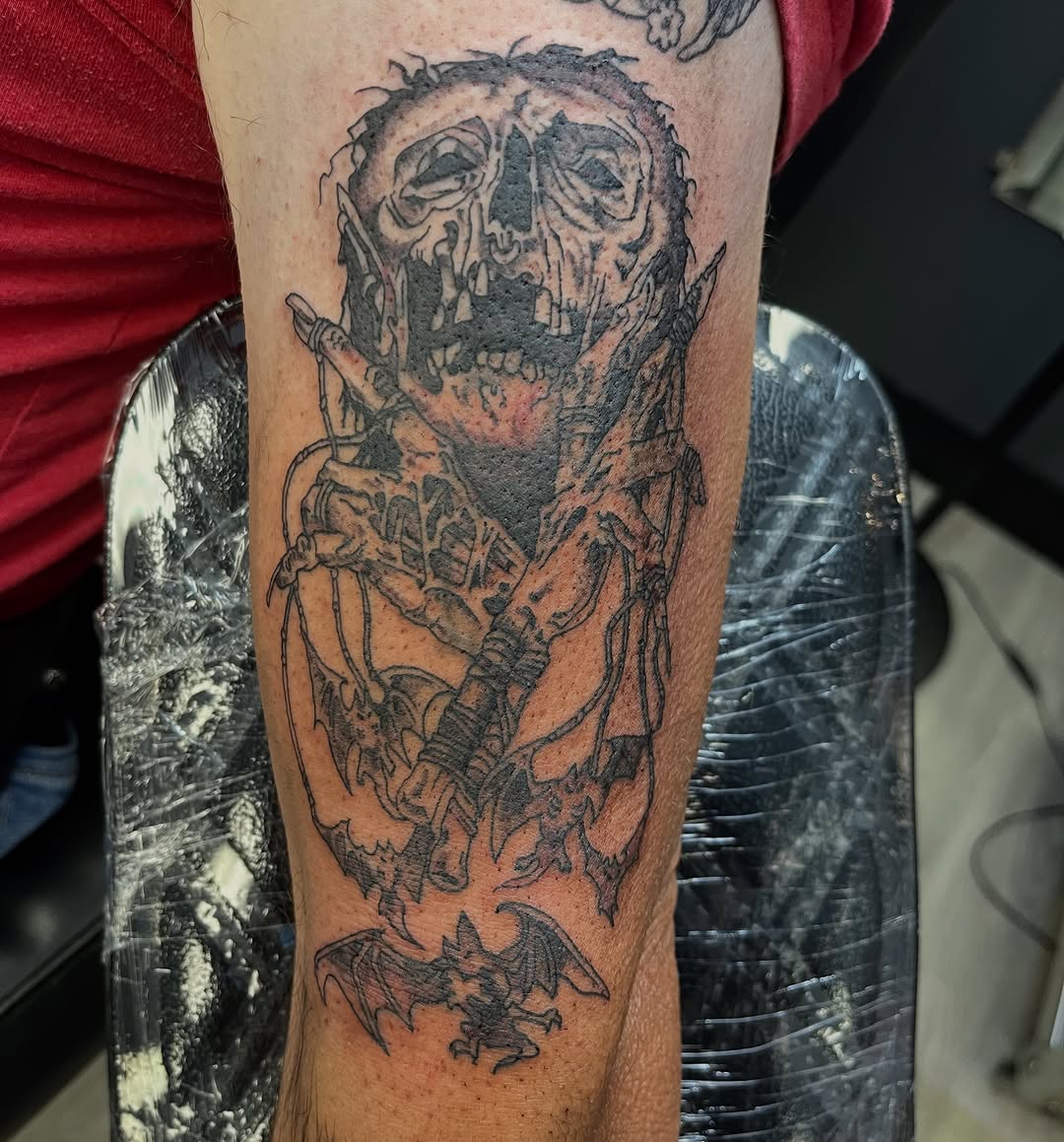 Tattoo by @enemytattoo — dark_realism, black_and_grey