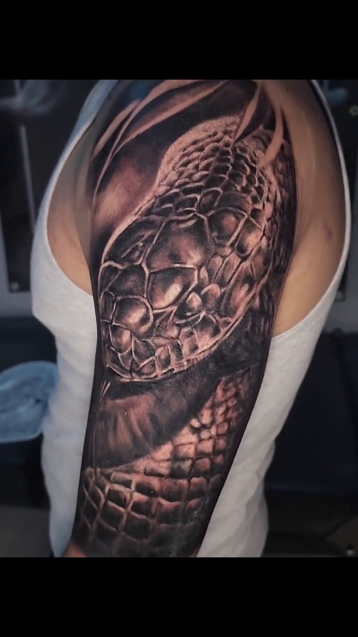 Tattoo by @zachmullinstattoos โ realism, black_and_grey