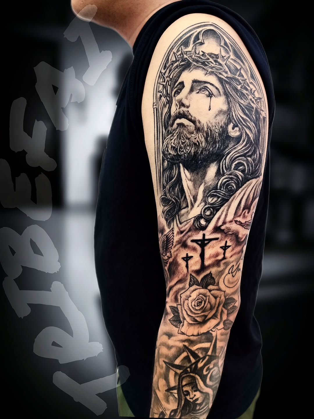 Tattoo by @tribe_tattoo — realism, black_and_grey