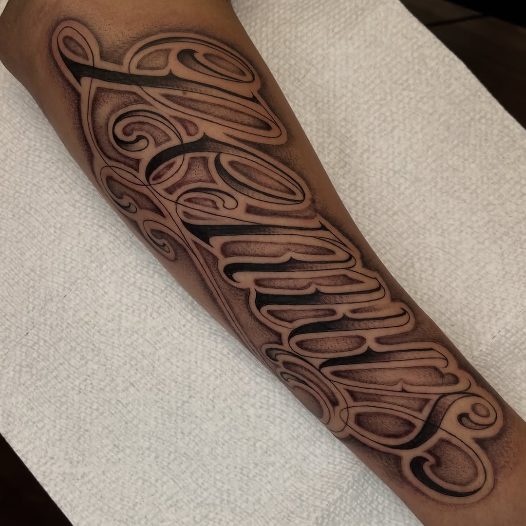 Tattoo by @jesus_pieces_ — lettering_script, chicano