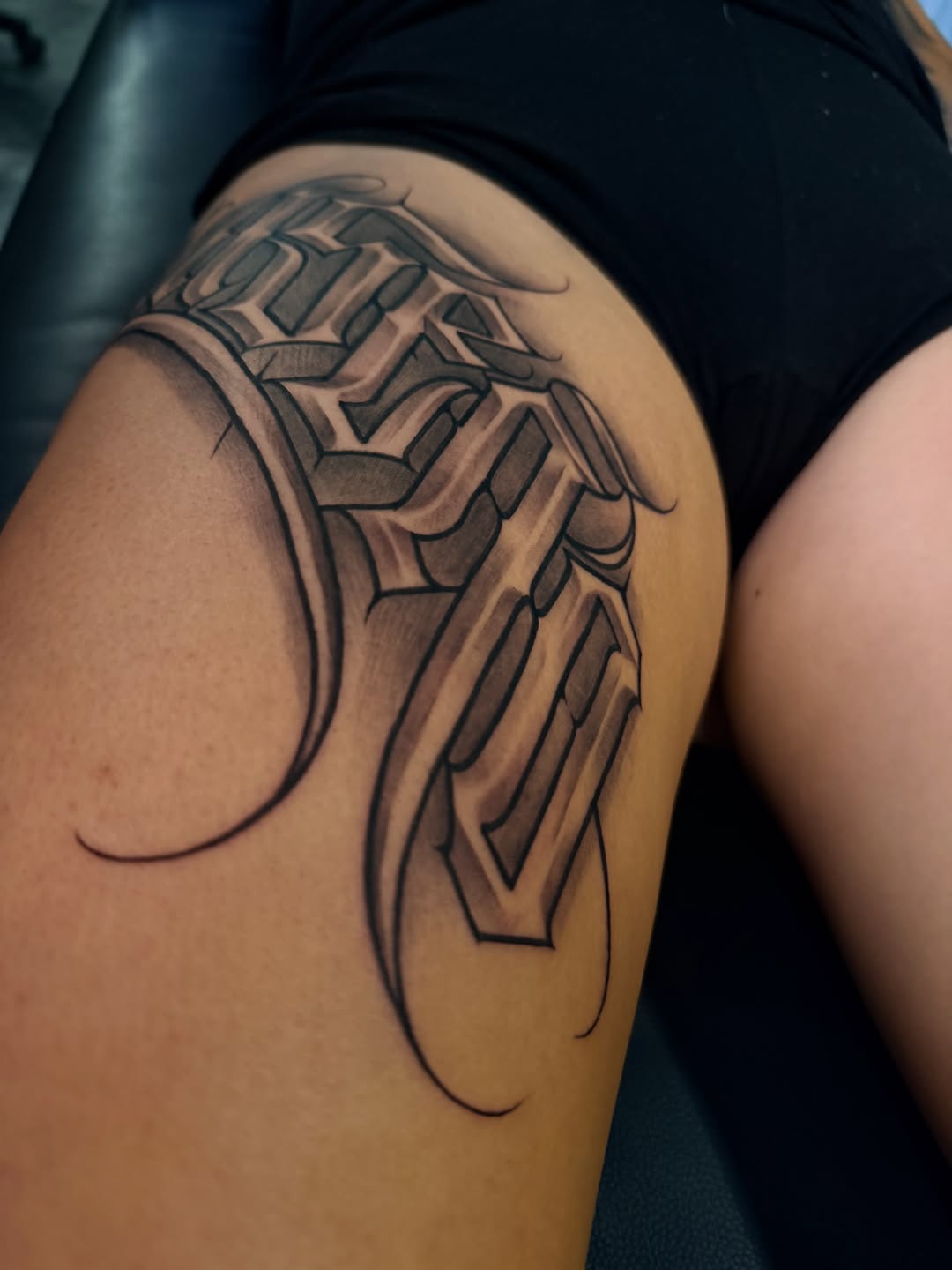 Tattoo by @stillballin6_ — lettering_script, chicano
