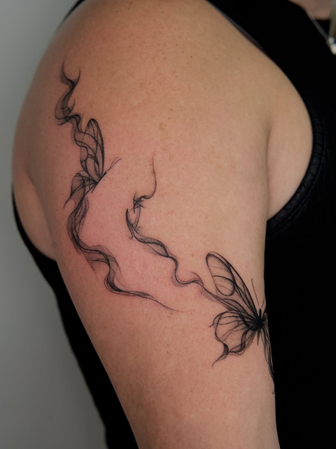 Tattoo by @tattooer_r.tee — fine_line, black_and_grey