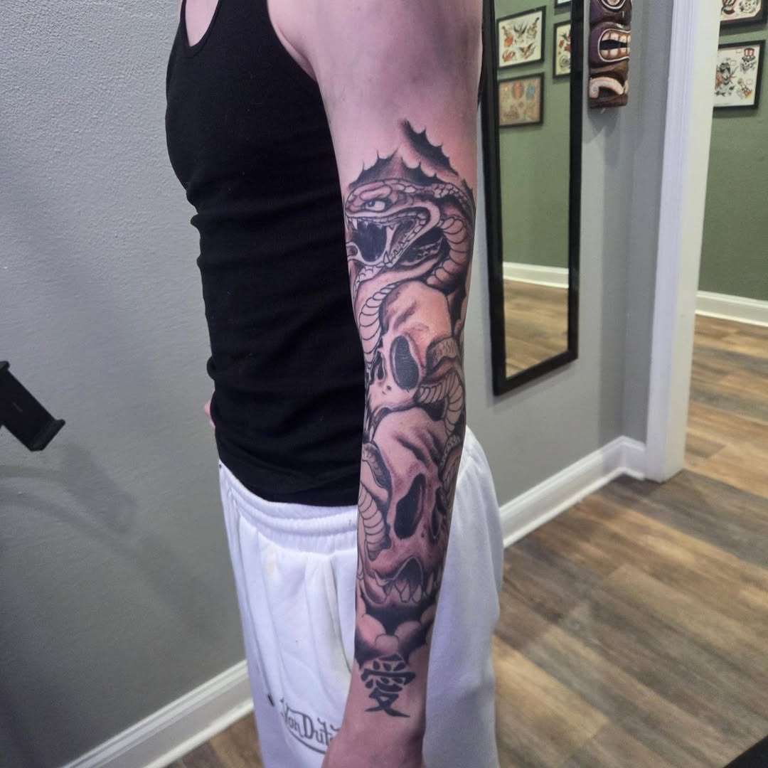Tattoo by @barryhuffman77 — black_and_grey, dark_realism