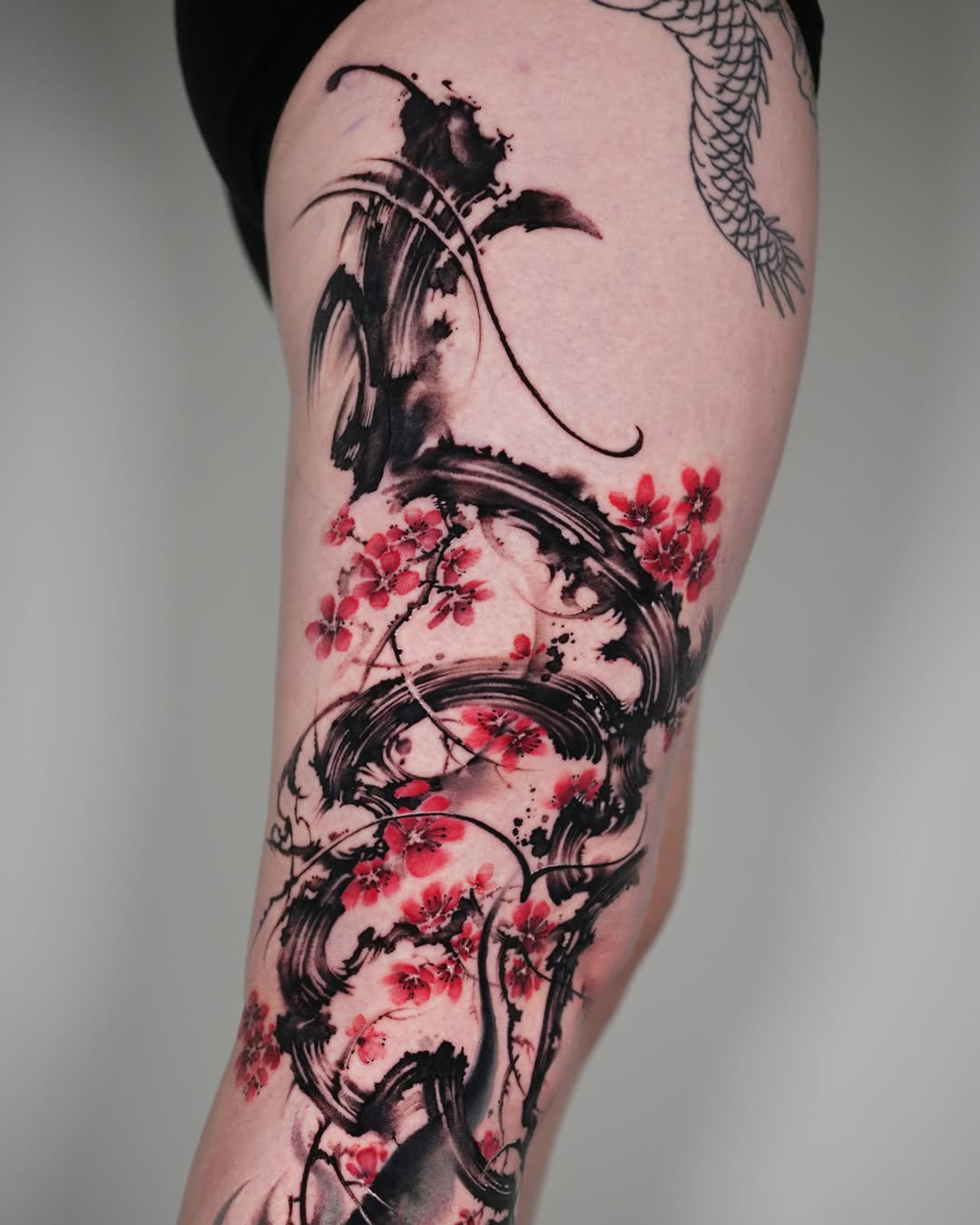 Tattoo by @jiya.brush — watercolor, blackwork