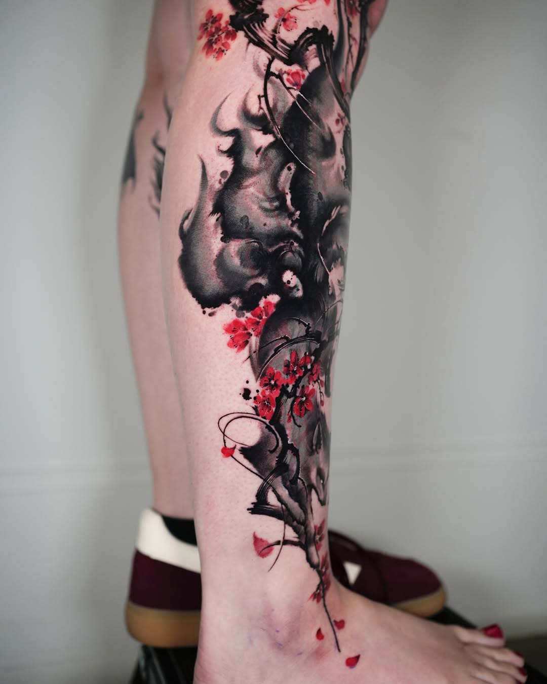 Tattoo by @jiya.brush — watercolor, blackwork
