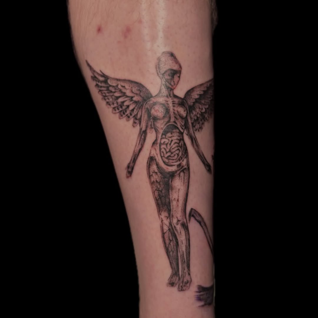 Tattoo by @piscesiscariot11 — black_and_grey, realism