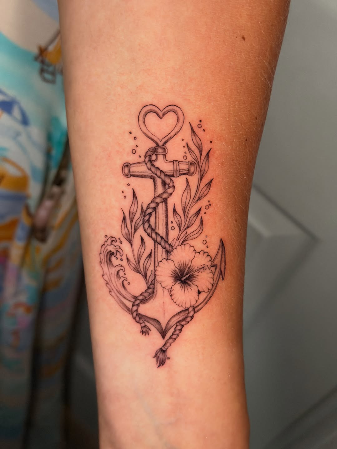 Tattoo by @nia.c__tattoo — fine_line, black_and_grey