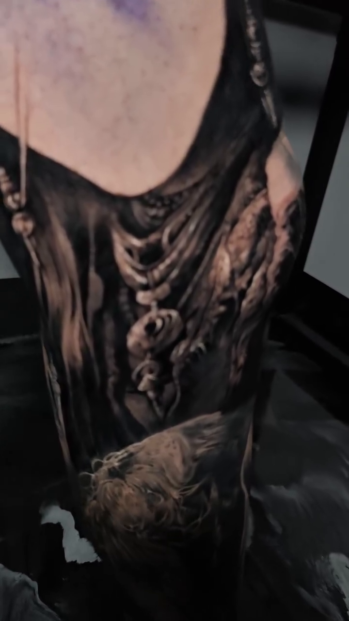 Tattoo by @nathan.matherstattooist — dark_realism, black_and_grey