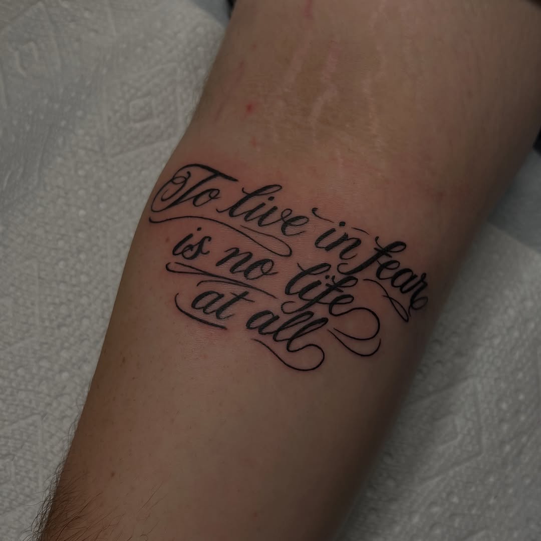 Tattoo by @lyvia.tattoo — lettering_script, fine_line