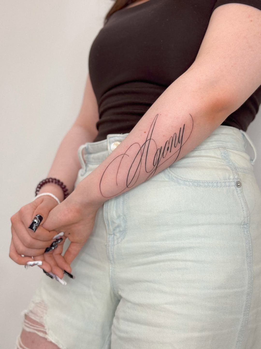 Tattoo by @romanova.skinart — lettering_script, fine_line