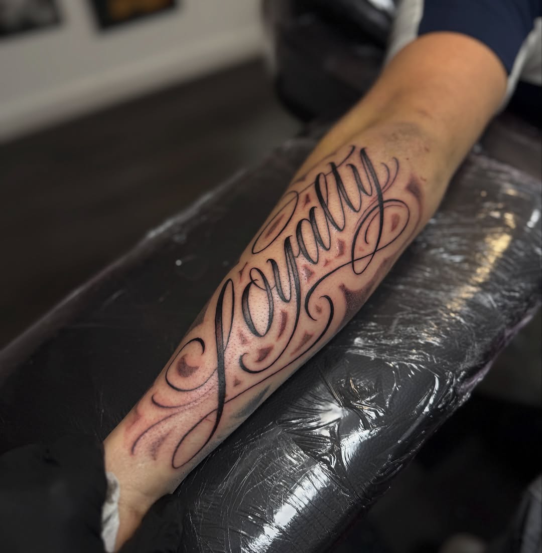 Tattoo by @jackcalliertattoos โ lettering_script, chicano