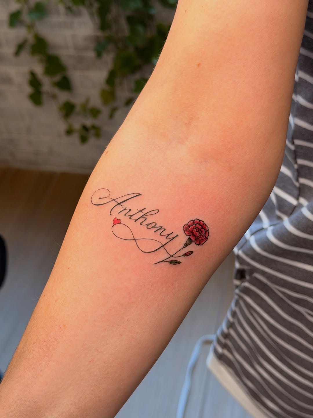 Tattoo by @inked_by_storm_sdt — lettering_script, fine_line