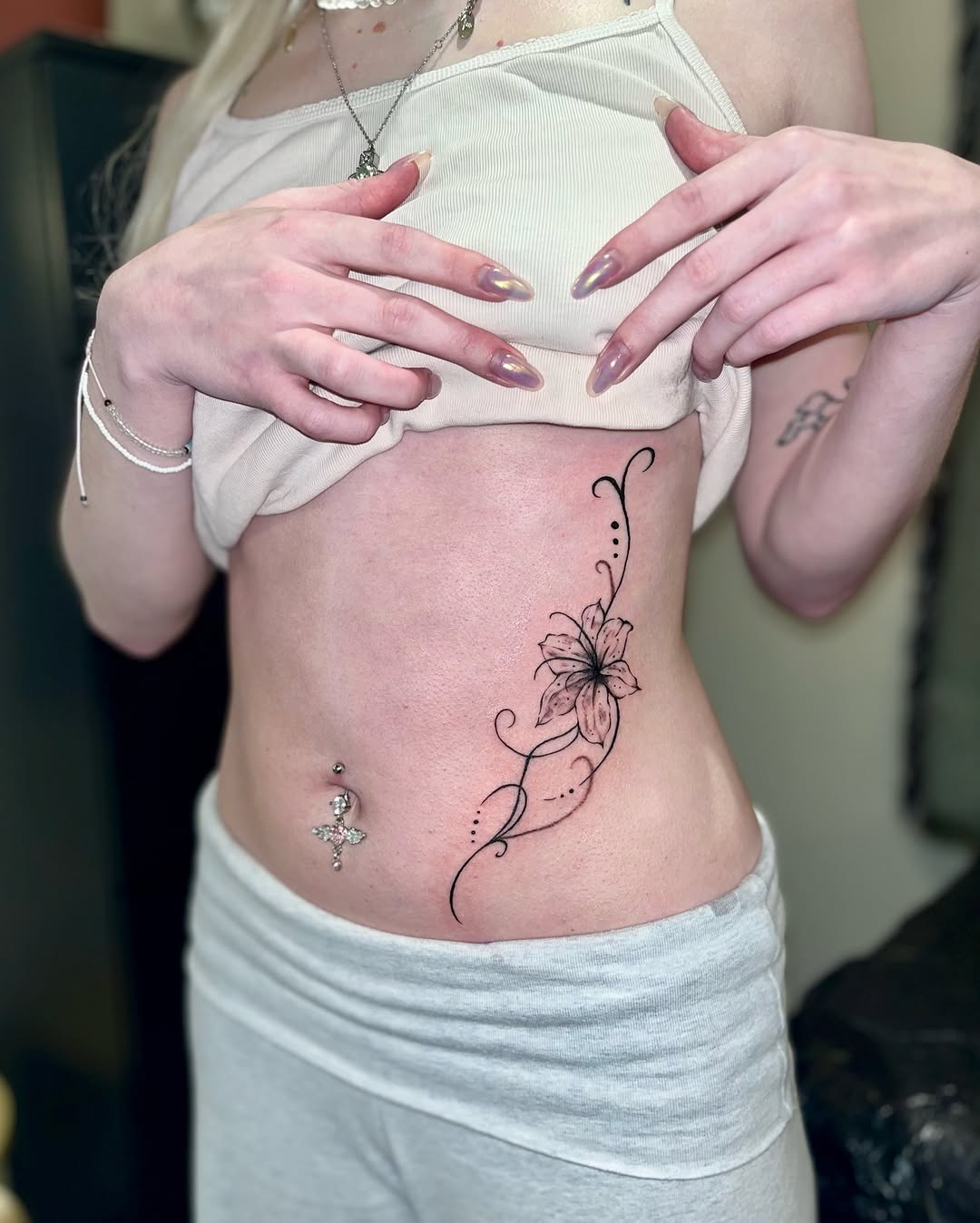 Tattoo by @mwah.ttt — fine_line, black_and_grey