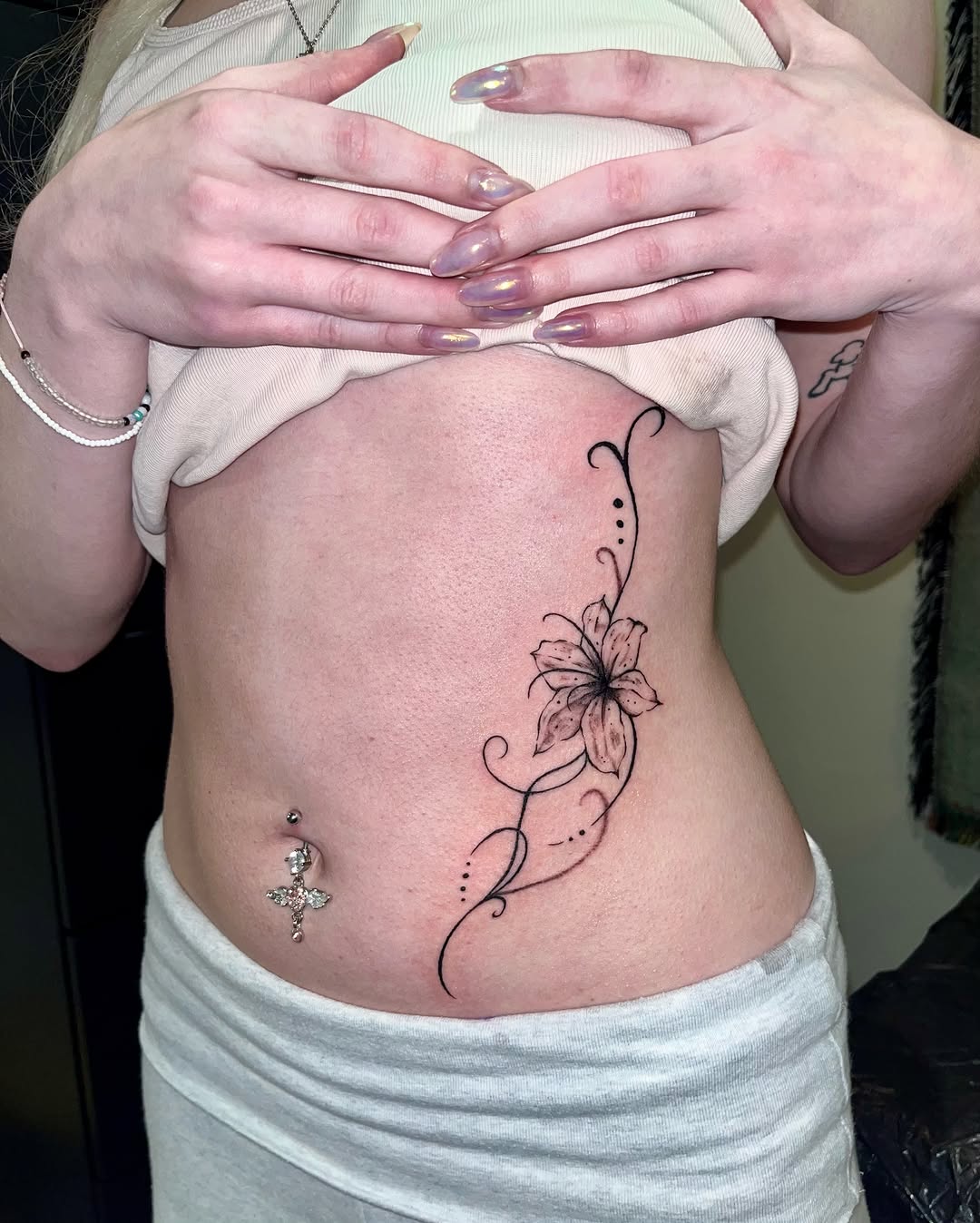 Tattoo by @mwah.ttt — fine_line, black_and_grey