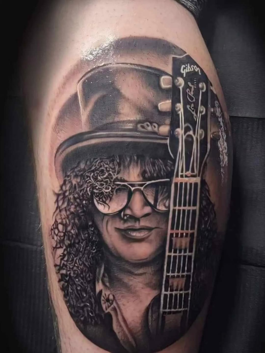 Tattoo by @rock_solid_tattoos — realism, black_and_grey