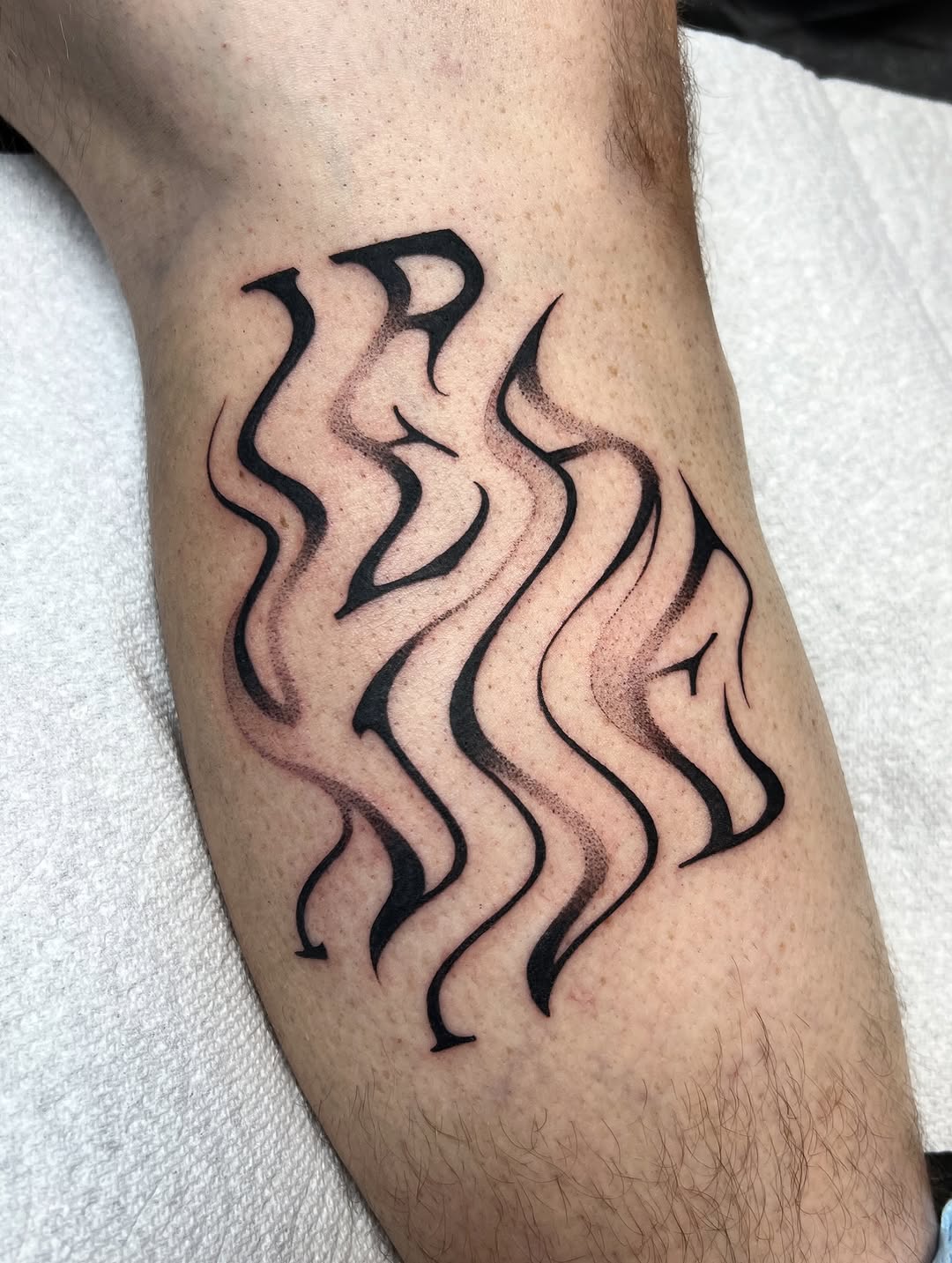 Tattoo by @sans.detour — lettering_script, black_and_grey