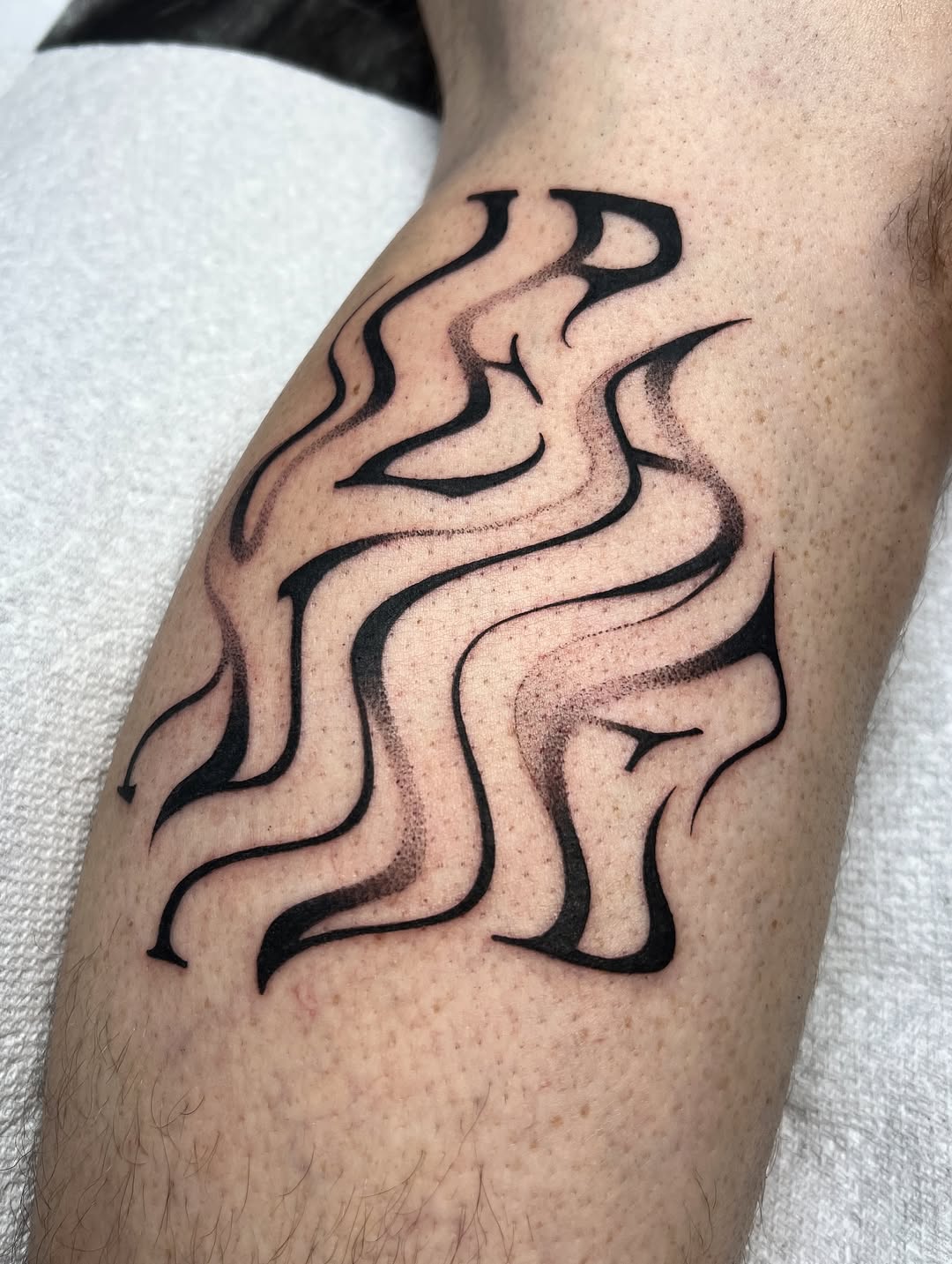 Tattoo by @sans.detour — blackwork, lettering_script
