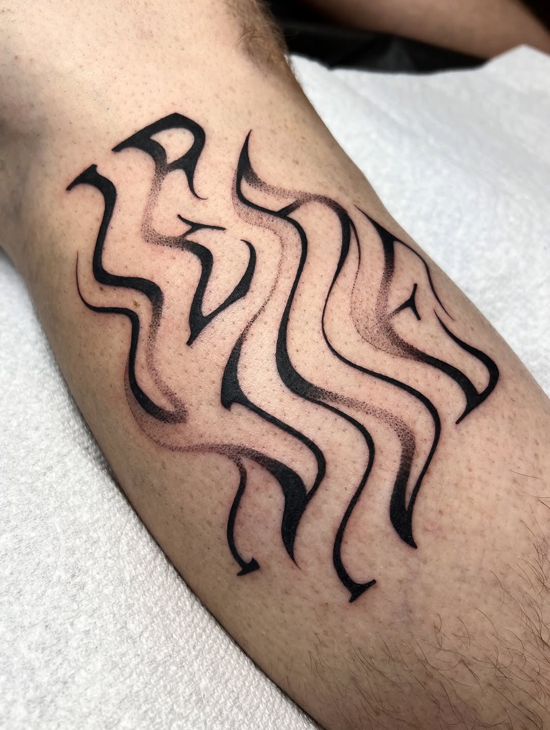Tattoo by @sans.detour — lettering_script, black_and_grey