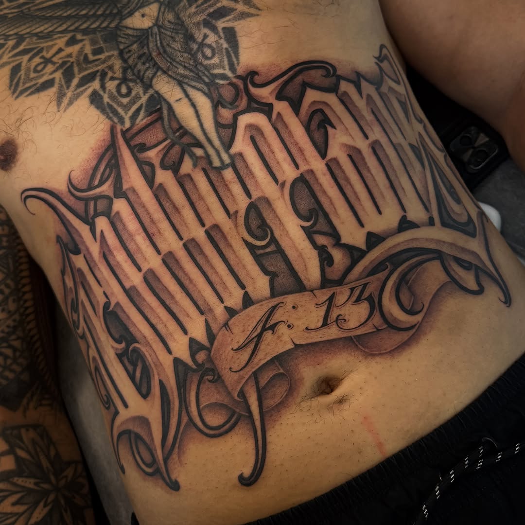 Tattoo by @dopeletterstattoo — lettering_script, chicano