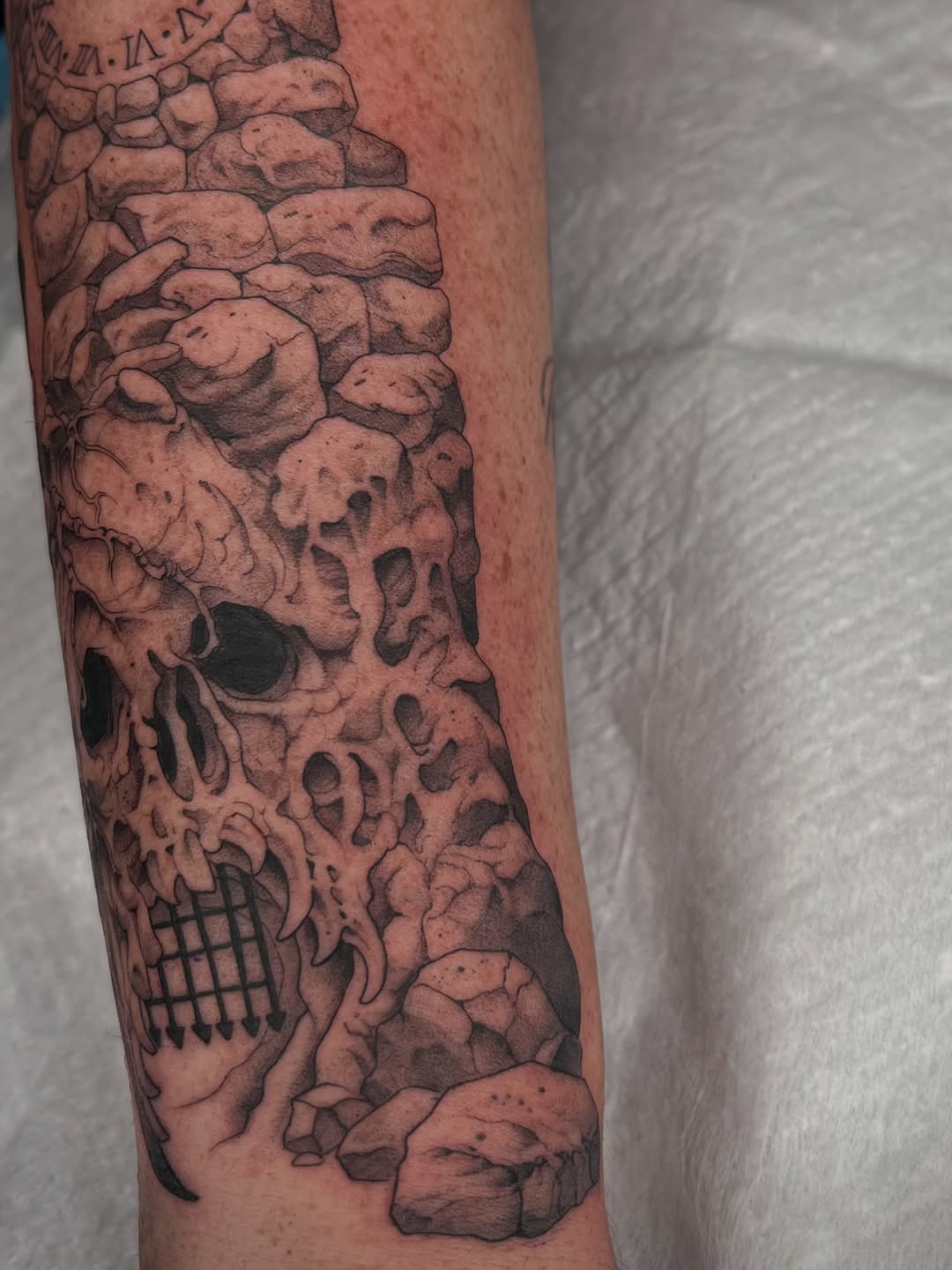 Tattoo by @revoltingworship — realism, black_and_grey