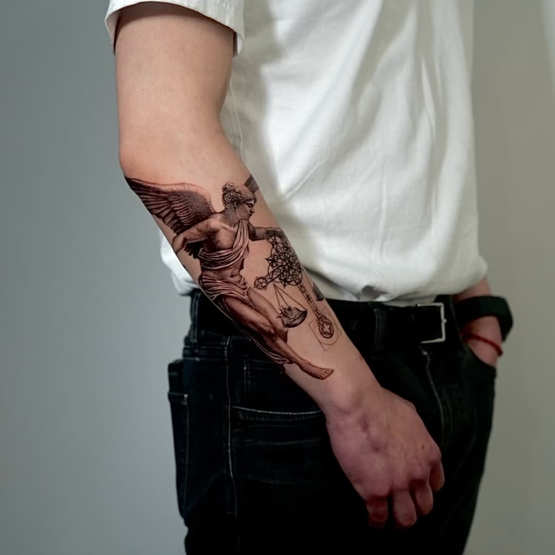 Tattoo by @ji.min.tt — realism, black_and_grey