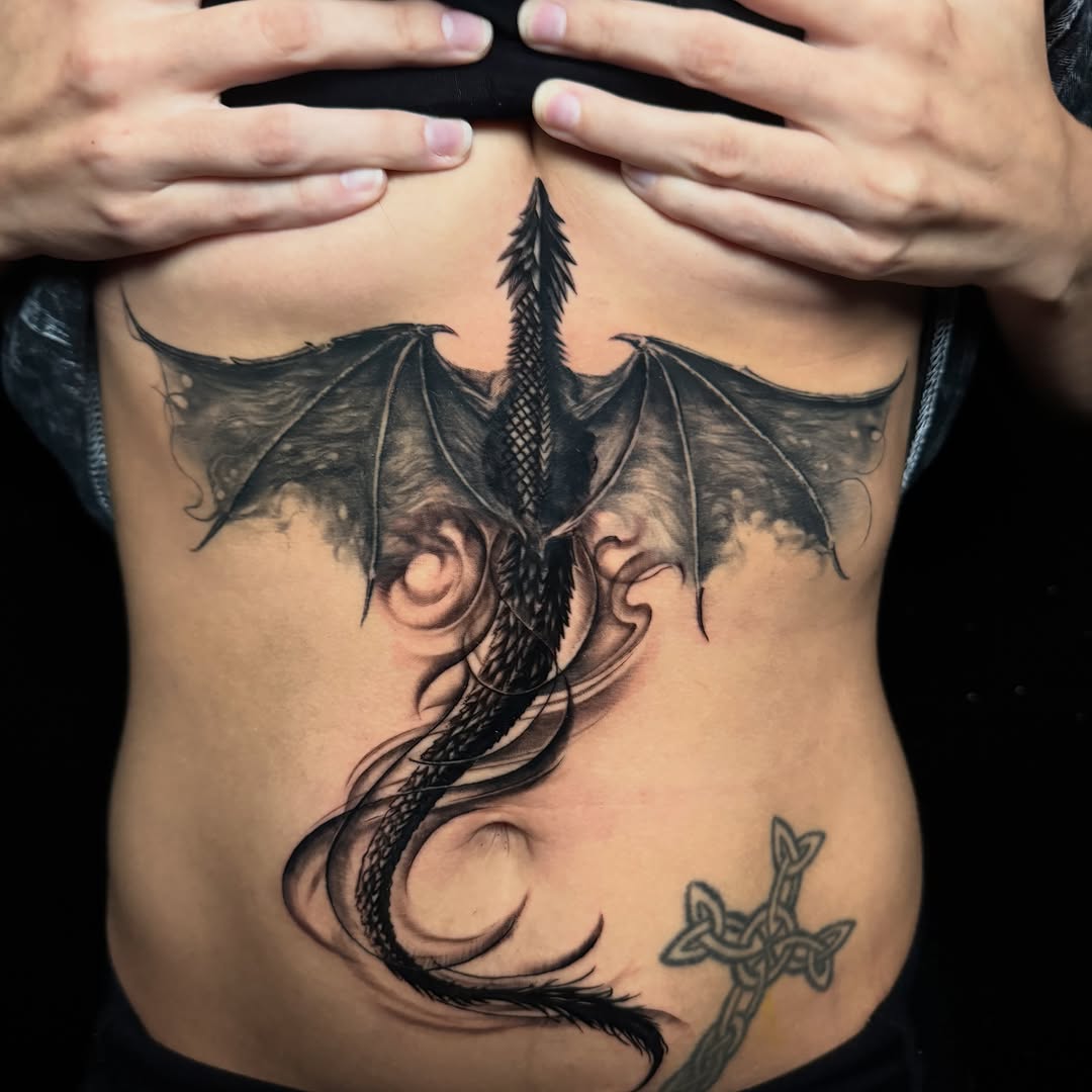Tattoo by @calebwhitetattoos — black_and_grey, realism