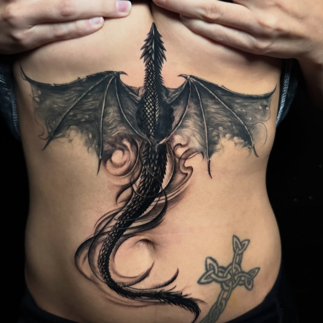 Tattoo by @calebwhitetattoos — black_and_grey, realism