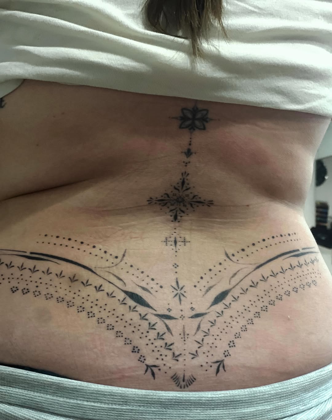 Tattoo by @aleks.north.tattoo — geometric, dotwork