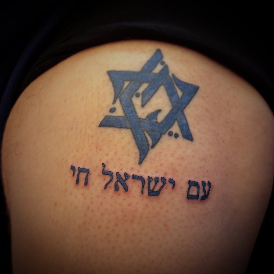 Tattoo by @yatush — lettering_script, blackwork
