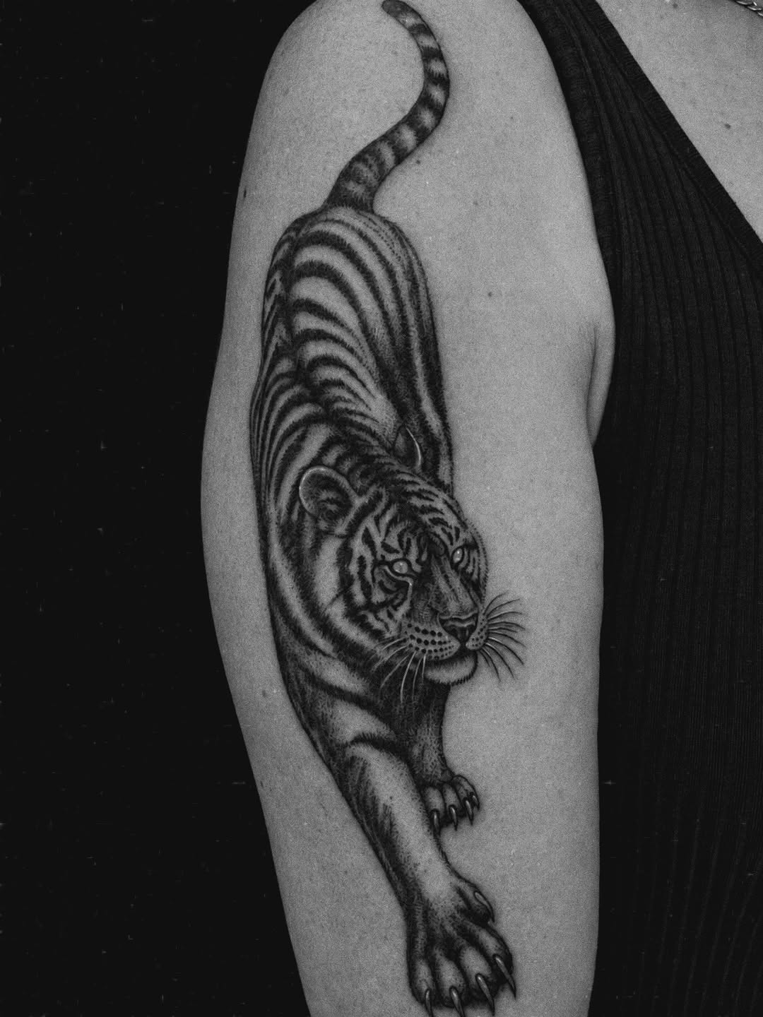 Tattoo by @amber_noir_tattoo โ realism, black_and_grey