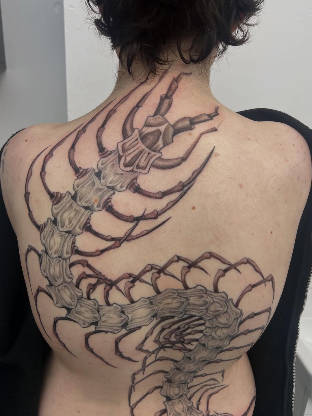 Tattoo by @real_street_tattoos — dark_realism, black_and_grey