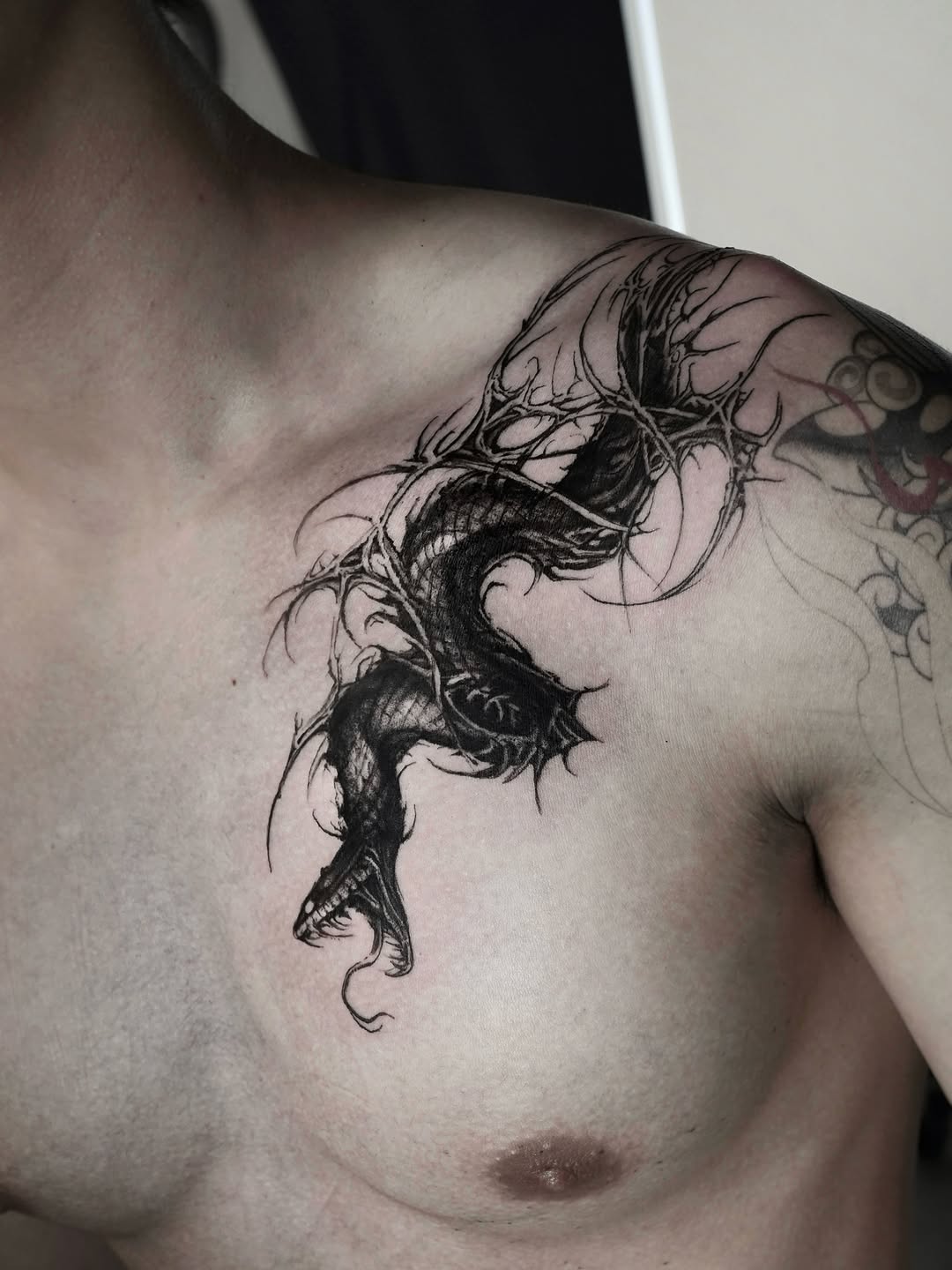 Tattoo by @gun_tattooist — black_and_grey, dark_realism