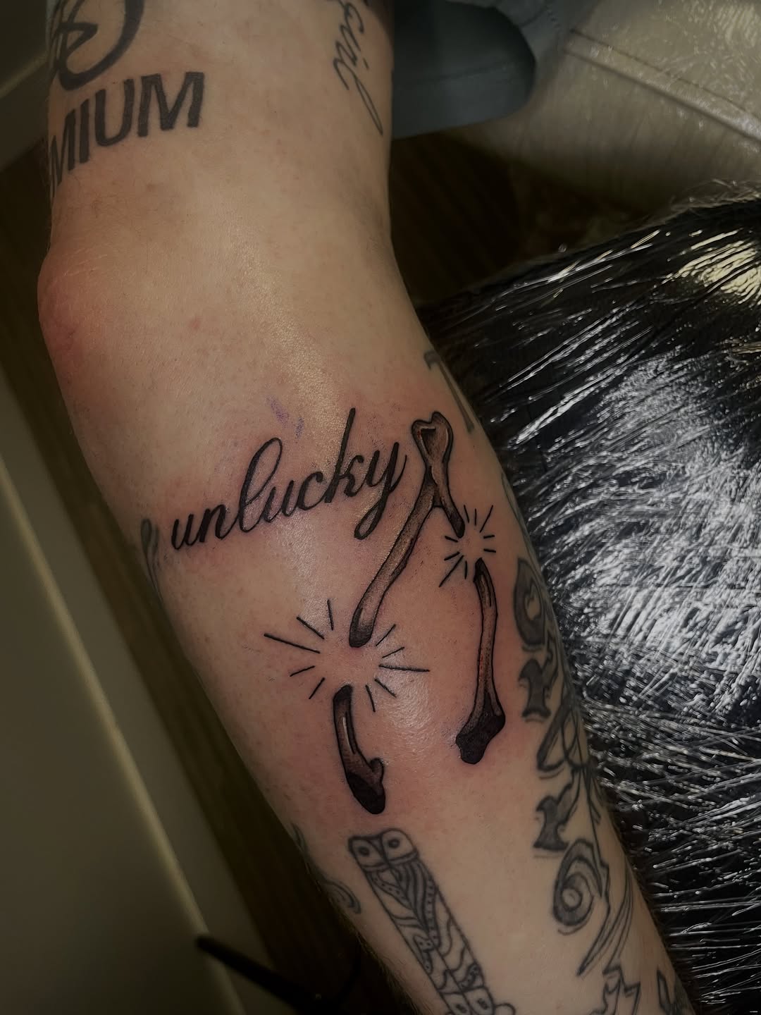 Tattoo by @redtideink — lettering_script, fine_line