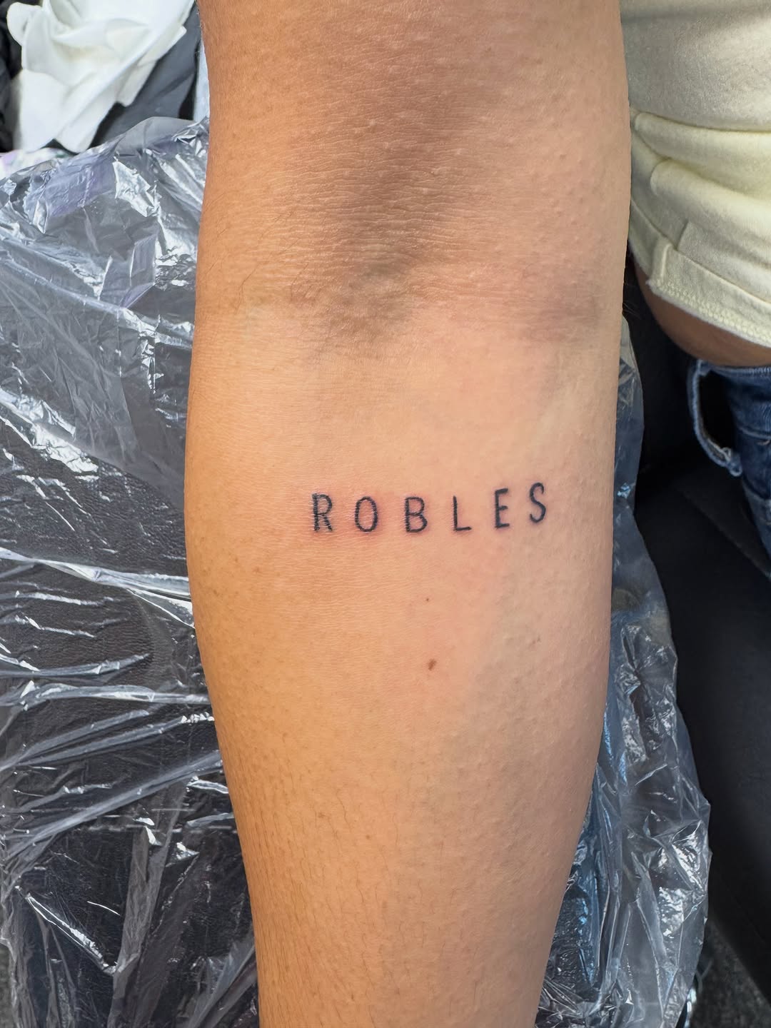 Tattoo by @hellion.ink — lettering_script, fine_line