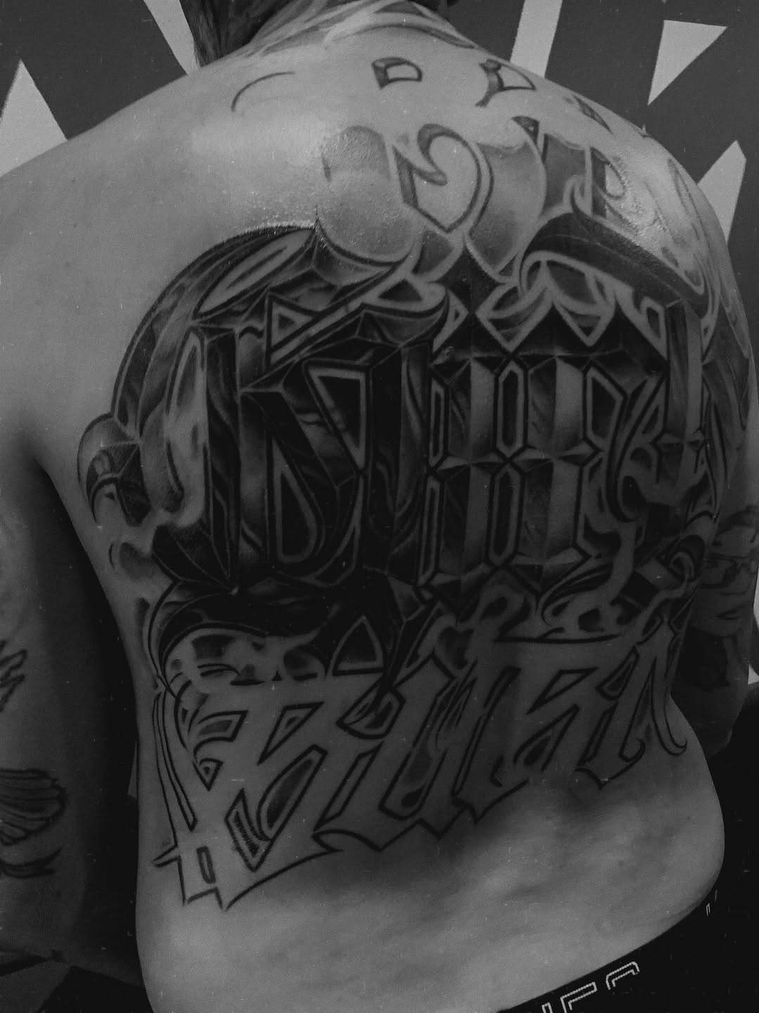 Tattoo by @paul_racks — lettering_script, black_and_grey