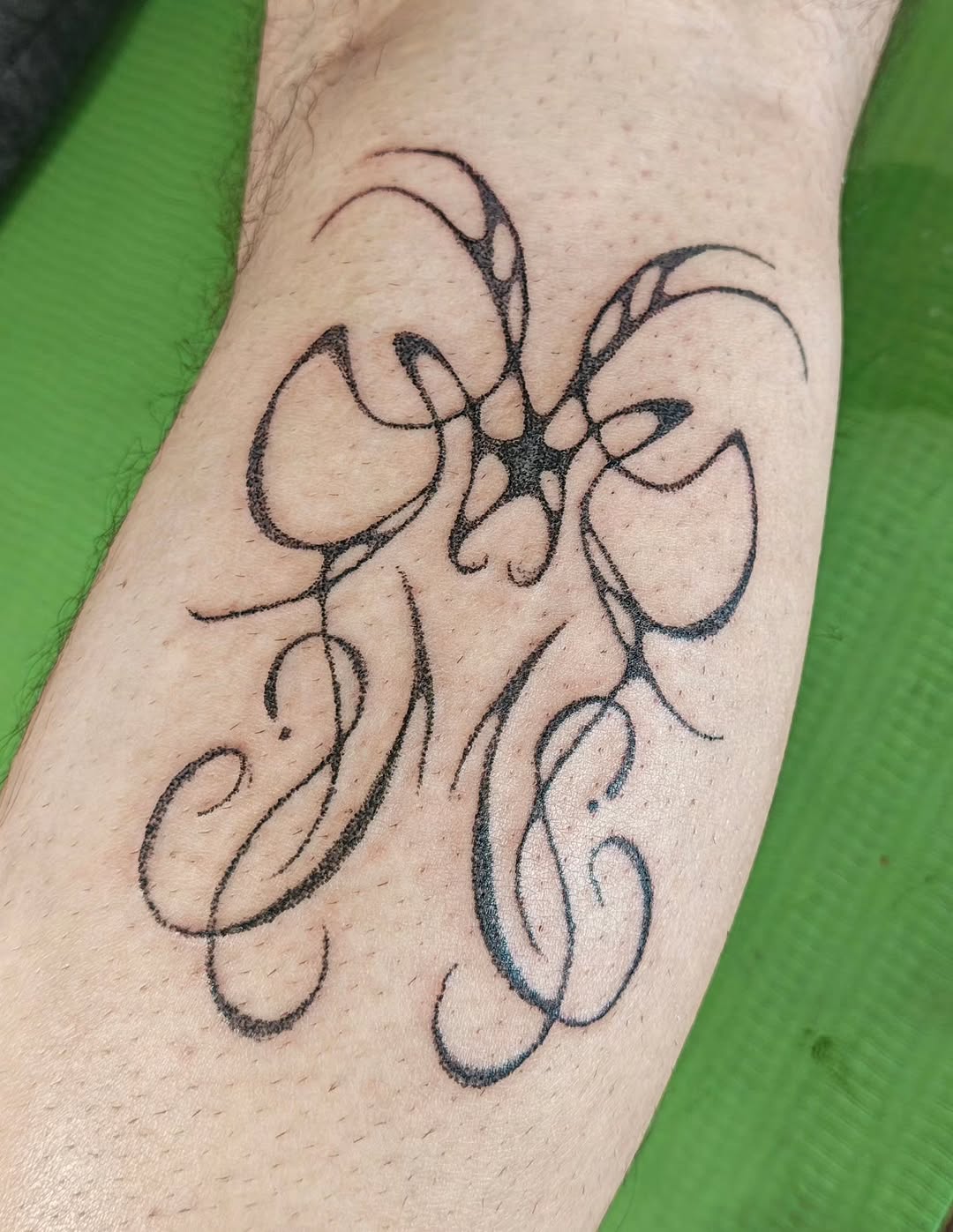Tattoo by @umubiri.tattoo — lettering_script, ornamental