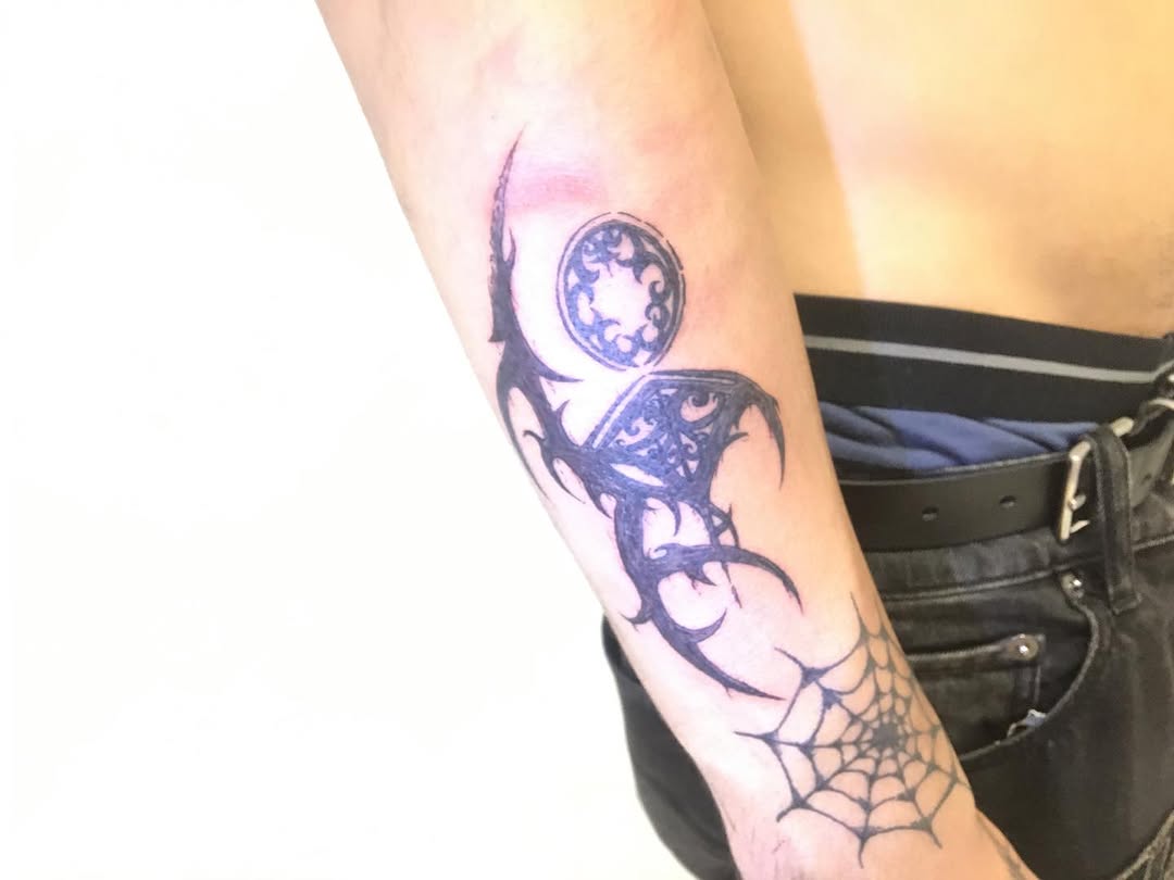 Tattoo by @stass.ink — tribal, blackwork
