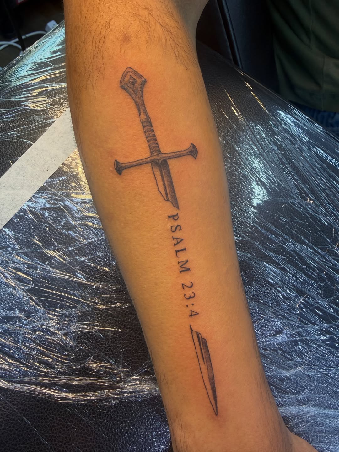 Tattoo by @sarai.inks — lettering_script, black_and_grey