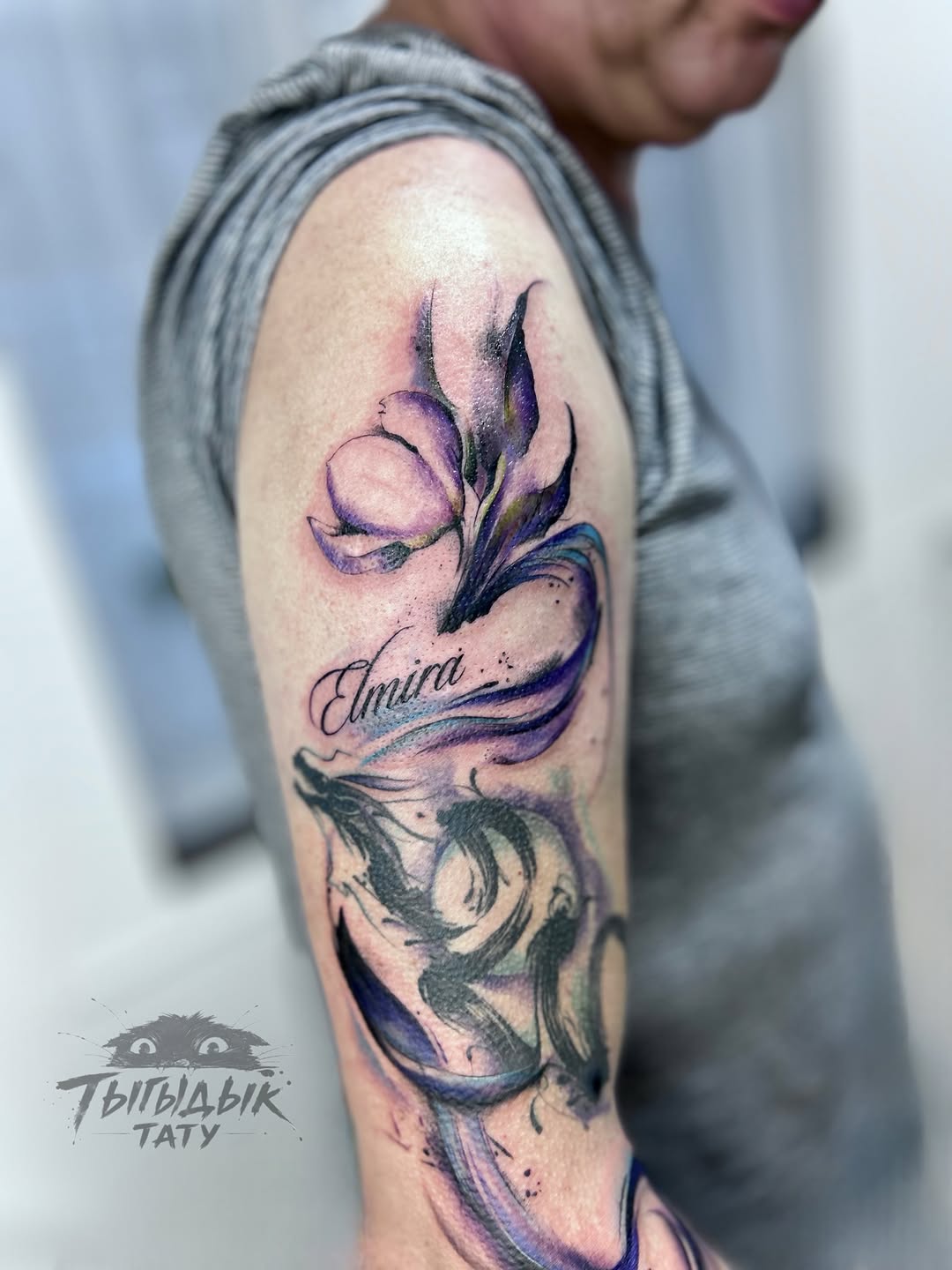 Tattoo by @tygydyk_tattoo — watercolor, lettering_script