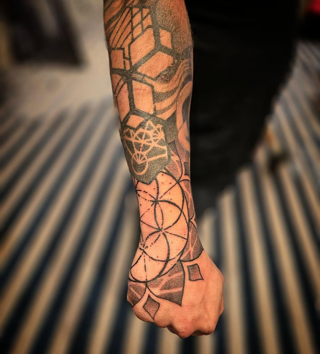 Tattoo by @aaronistattoo — geometric, dotwork